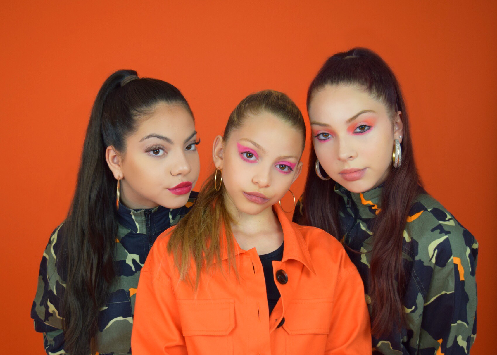 Female Sibling Trio Triple Charm Create An Uplifting Battle Cry with